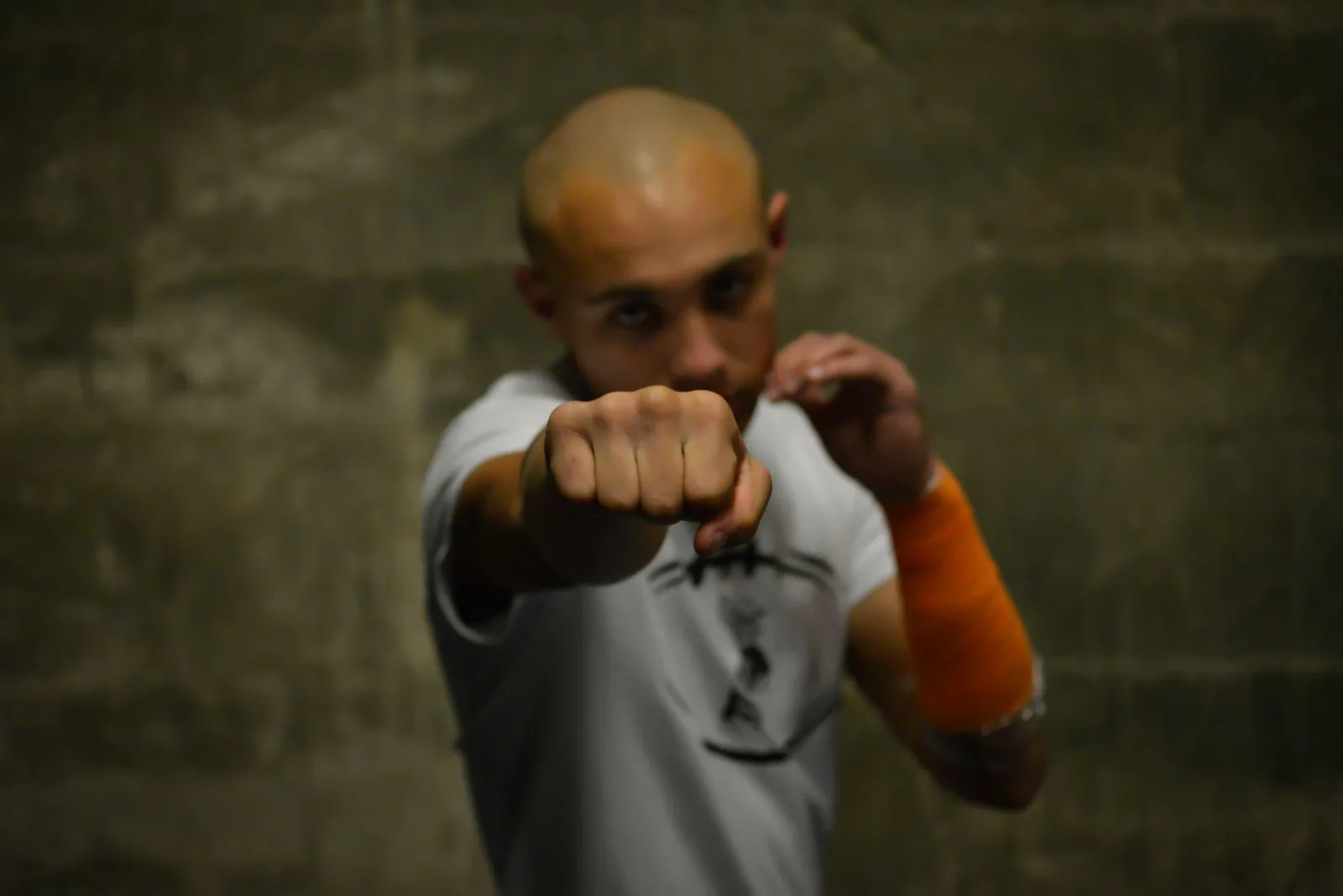 A fighter throws a punch during training, highlighting the physical demands of bare knuckle boxing in Central Valley.